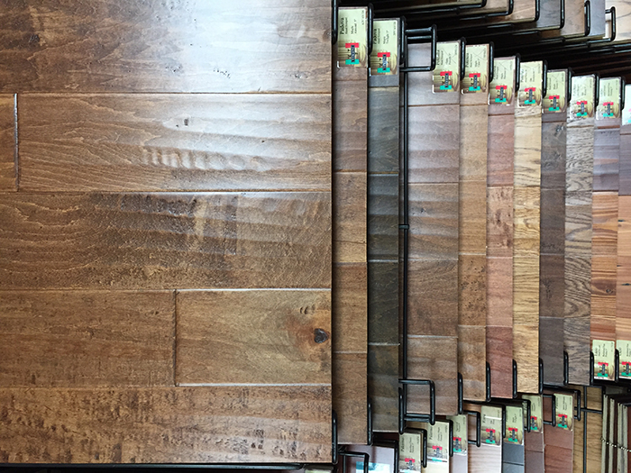 Waterproof luxury vinyl plank samples arranged by color